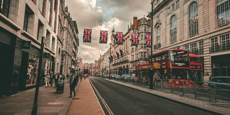 Photo by <a href="https://unsplash.com/@bizzyspace_images?utm_source=unsplash&utm_medium=referral&utm_content=creditCopyText">Sean P</a> on <a href="https://unsplash.com/photos/a-street-scene-with-a-double-decker-bus-on-the-road-WuCX5qOLu3Q?utm_source=unsplash&utm_medium=referral&utm_content=creditCopyText">Unsplash</a>       