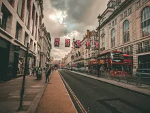 Photo by <a href="https://unsplash.com/@bizzyspace_images?utm_source=unsplash&utm_medium=referral&utm_content=creditCopyText">Sean P</a> on <a href="https://unsplash.com/photos/a-street-scene-with-a-double-decker-bus-on-the-road-WuCX5qOLu3Q?utm_source=unsplash&utm_medium=referral&utm_content=creditCopyText">Unsplash</a>       