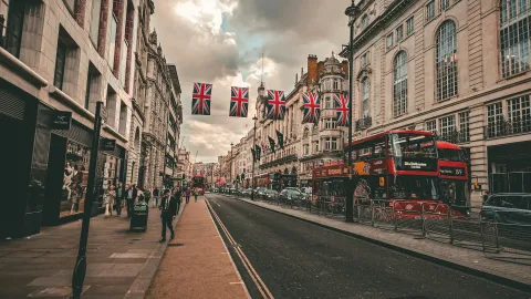 Photo by <a href="https://unsplash.com/@bizzyspace_images?utm_source=unsplash&utm_medium=referral&utm_content=creditCopyText">Sean P</a> on <a href="https://unsplash.com/photos/a-street-scene-with-a-double-decker-bus-on-the-road-WuCX5qOLu3Q?utm_source=unsplash&utm_medium=referral&utm_content=creditCopyText">Unsplash</a>       