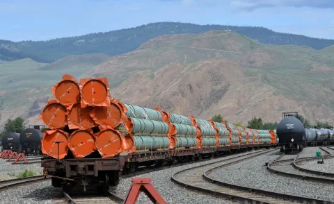 steel-pipe-to-be-used-in-the-pipeline-construction-of-kinder-morgan-canadas-trans-mountain-expansion-project-sit-on-rail-cars-at-a-stockpile-site-in-kamloops